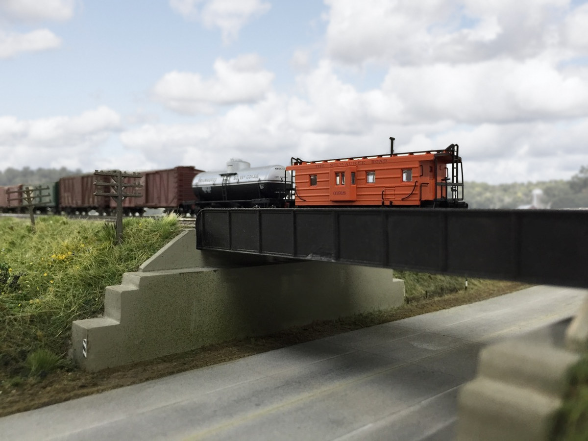 Milwaukee Road caboose on the Hwy 20 bridge