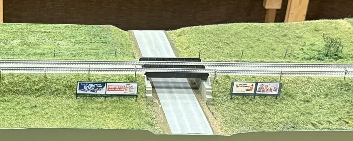 Railroad bridge over the highway with billboards on the Hwy 20 module
