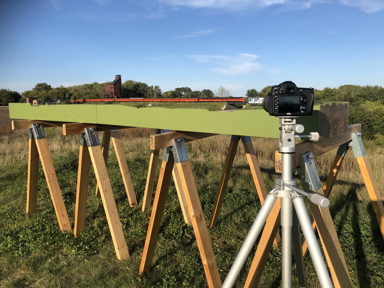 Behind the scenes: Modutrak modules on sawhorses outdoors with a camera on a tripod