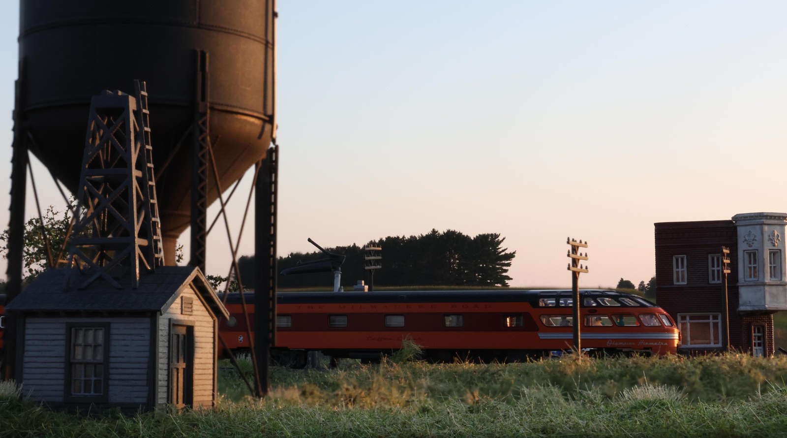Water tower and the Olympian Hiawatha at sunset on the Modutrak Sturtevant module