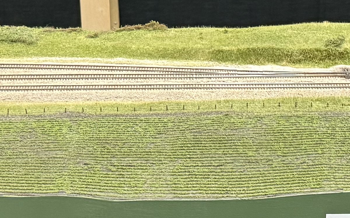 The double main past a large crop field on Tower A-68